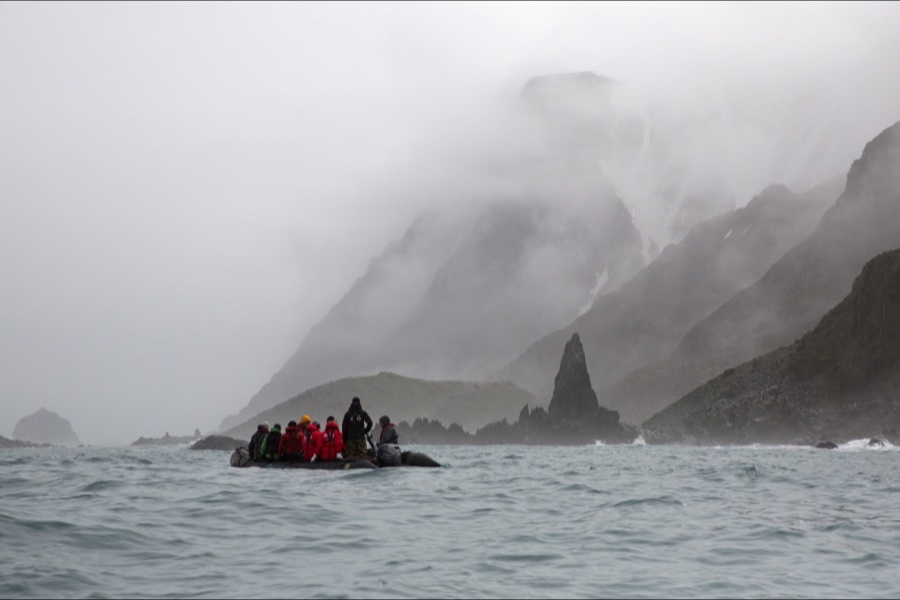 Zodiac approaching the rugged coast of Elephant Island