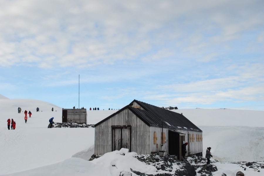 Expedition landing near a historic Antarctic hut