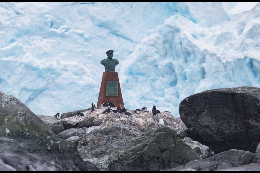 Historic monument and penguins at Elephant Island